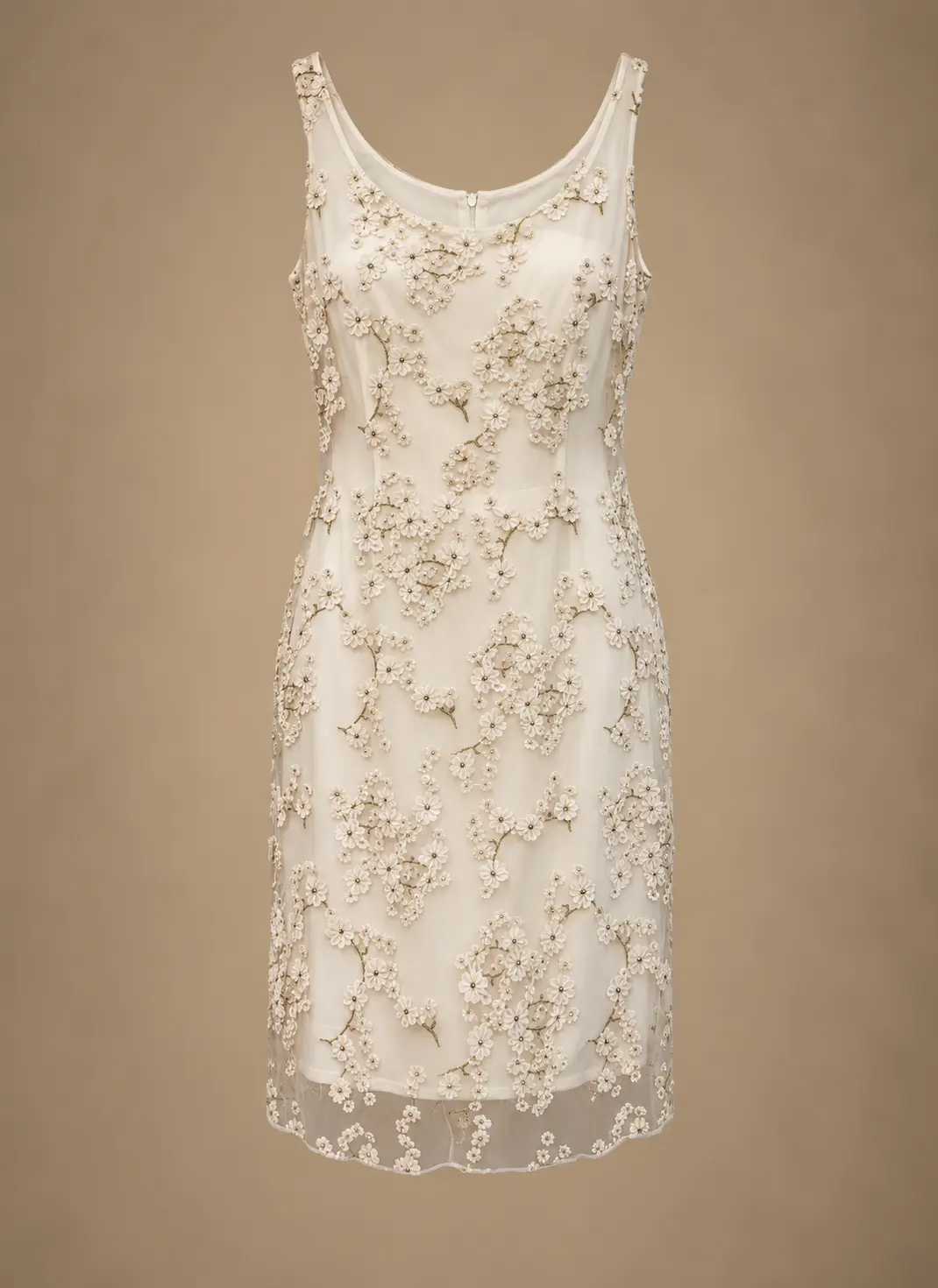Ivory sleeveless knee-length dress decorated with intricate floral appliqués, delicate beadwork and a sheer overlay
