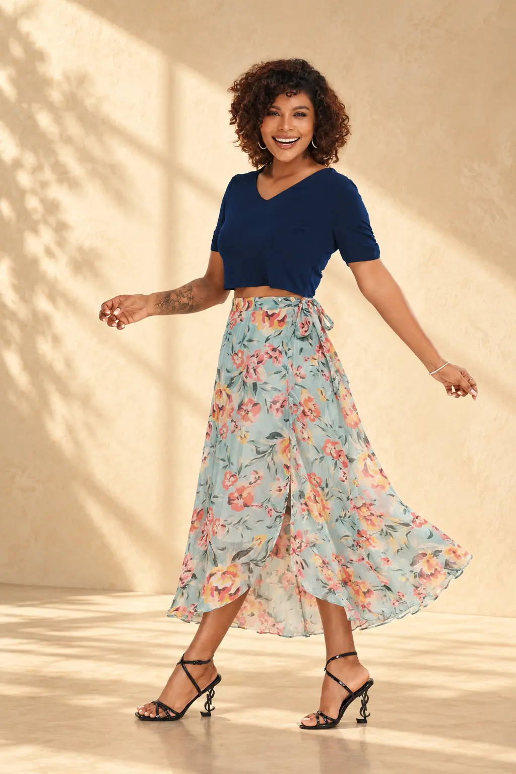 Model in a navy blue short-sleeve crop top and flowing floral wrap midi skirt, highlighting Trendywear's contemporary women's fashion collection